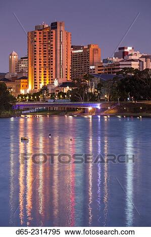 Stock Photography - Australia, South Australia, Adelaide, skyline from Torrens Lake, daytime, dusk.. Fotosearch