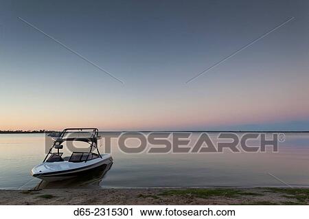 Stock Image - Australia, South Australia, Murray River Valley, Barmera, Lake Bonney, boat, dusk.. Fotosearch