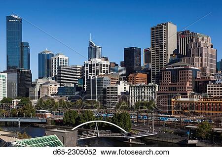 Stock Image - Australia, Victoria, VIC, Melbourne, skyline along the Yarra River towards Rialto Towers, elevated view, morning.. Fotosearch