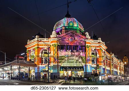Australia, Victoria, VIC, Melbourne, Flinders Street Train Station, lit with projected laser designs, White Nights Festival. View Large Photo Image Stock Photo - Australia, Victoria, VIC, Melbourne, Flinders Street Train Station, lit with projected laser designs, White Nights Festival.. Fotosearch