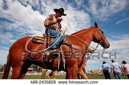 Stock Photo - Australian Cowboys at the annual Lang Lang Rodeo. Victoria, Australia.. Fotosearch