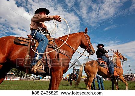 Stock Photo - Australian Cowboys at the annual Lang Lang Rodeo. Victoria, Australia.. Fotosearch