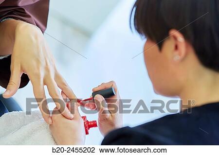 Beautician painting nails a woman. Manicure. Hairdressing salon and Beauty Clinic. View Large Photo Image Stock Image - Beautician painting nails a woman. Manicure. Hairdressing salon and Beauty Clinic.. Fotosearch