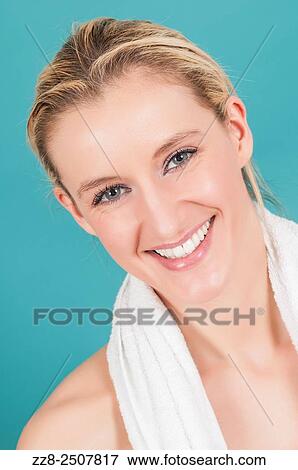 Beautiful young Caucasian woman with a white towel smiling. View Large Photo Image Stock Photo - Beautiful young Caucasian woman with a white towel smiling.. Fotosearch