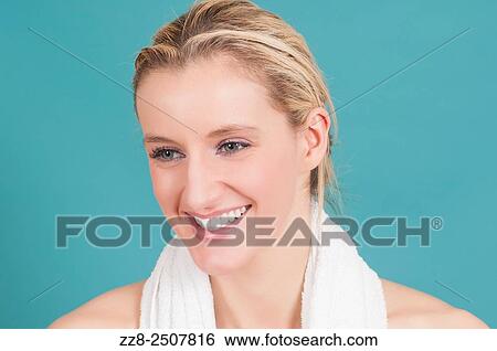 Beautiful young Caucasian woman with a white towel smiling. View Large Photo Image Stock Photograph - Beautiful young Caucasian woman with a white towel smiling.. Fotosearch