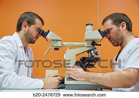 Stock Photo - Binocular microscope heads for multiple viewing, Anatomic Pathology, Hospital Donostia, San Sebastian, Gipuzkoa, Basque Country, Spain. Fotosearch