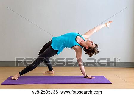 Camatkarasana yoga pose. View Large Photo Image Stock Photograph - Camatkarasana yoga pose.. Fotosearch