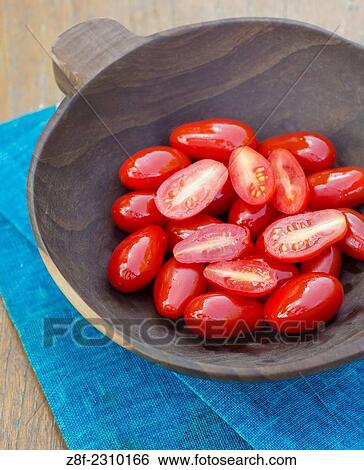 cherry tomato in a wooden bowl. View Large Photo Image Stock Photograph - cherry tomato in a wooden bowl.. Fotosearch