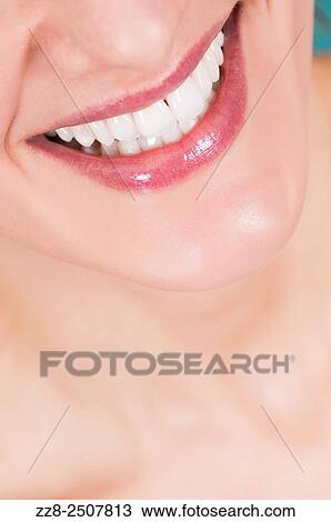 Closeup of a beautiful young woman smiling with healthy white teeth. View Large Photo Image Stock Image - Closeup of a beautiful young woman smiling with healthy white teeth.. Fotosearch