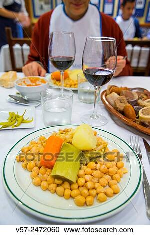 Stock Image - Cocido madrileño serving in a restaurant. Madrid, Spain.. Fotosearch