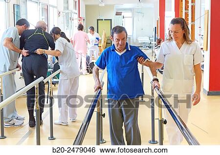 Stock Photograph - Control of walking, parallel bars, reeducation exercise, Rebahilitation, Hospital Donostia, San Sebastian, Gipuzkoa, Basque Country, Spain. Fotosearch