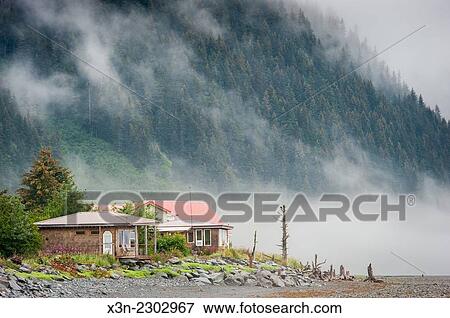 Cottage home at the base of a mountain in Seward, Alaska. View Large Photo Image Stock Photo - Cottage home at the base of a mountain in Seward, Alaska.. Fotosearch