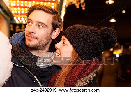 Stock Photo - couple with cotton candy.. Fotosearch