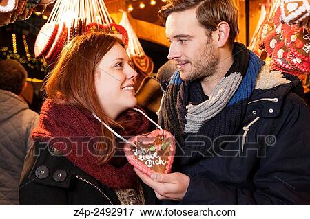 couple with german gingerbread heart on christman market. View Large Photo Image Stock Photo - couple with german gingerbread heart on christman market.. Fotosearch