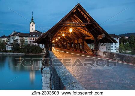 Stock Photo - Covered bridge over Aare river in Olten at dawn, canton of Solothurn, Switzerland.. Fotosearch
