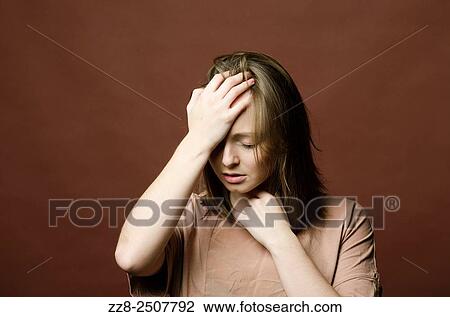 Depressed young woman hand on head. View Large Photo Image Stock Image - Depressed young woman hand on head.. Fotosearch