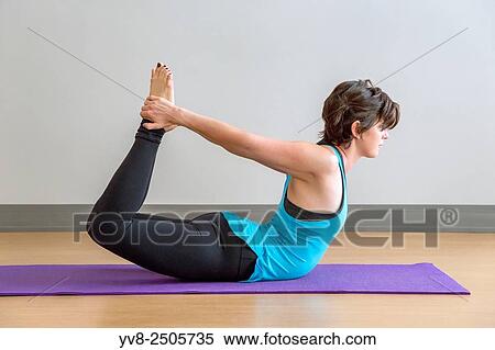 Dhanurasana Yoga pose. View Large Photo Image Stock Photography - Dhanurasana Yoga pose.. Fotosearch