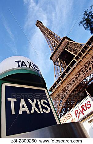 Eiffel Tower with Taxi stand sign. View Large Photo Image Stock Image - Eiffel Tower with Taxi stand sign.. Fotosearch