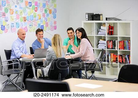 Executives at meeting table. Office. Coworking. View Large Photo Image Picture - Executives at meeting table. Office. Coworking.. Fotosearch