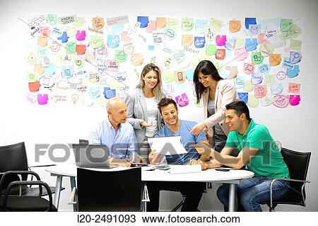 Executives at meeting table. Office. Coworking. View Large Photo Image Stock Image - Executives at meeting table. Office. Coworking.. Fotosearch