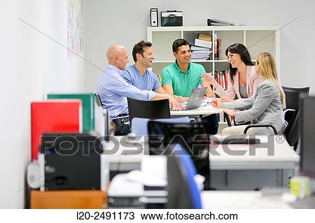 Executives at meeting table. Office. Coworking. View Large Photo Image Stock Image - Executives at meeting table. Office. Coworking.. Fotosearch