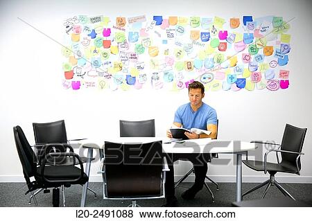 Executives at meeting table. Office. Coworking. View Large Photo Image Stock Photo - Executives at meeting table. Office. Coworking.. Fotosearch
