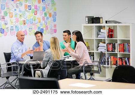 Executives at meeting table. Office. Coworking. View Large Photo Image Stock Photography - Executives at meeting table. Office. Coworking.. Fotosearch