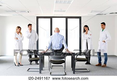 Stock Photo - Executives. Empty office. Meeting room.. Fotosearch