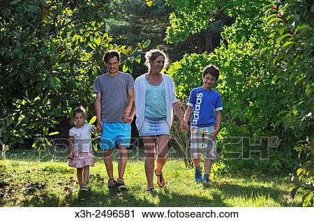 family walking in a garden, Ile-de-France region, France, Europe. View Large Photo Image Stock Image - family walking in a garden, Ile-de-France region, France, Europe.. Fotosearch
