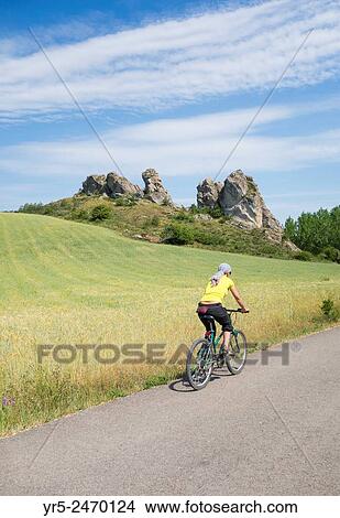 Female cyclist alongside river Pisuerge near Aguilar de Campoo, Palencia Province, Spain. View Large Photo Image Picture - Female cyclist alongside river Pisuerge near Aguilar de Campoo, Palencia Province, Spain.. Fotosearch