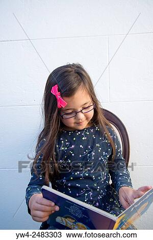 Five year old girl reading book. View Large Photo Image Stock Image - Five year old girl reading book.. Fotosearch