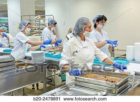 Stock Image - Food serving line, Hospital meal preparation, Kitchen, Hospital Donostia, San Sebastian, Gipuzkoa, Basque Country, Spain. Fotosearch