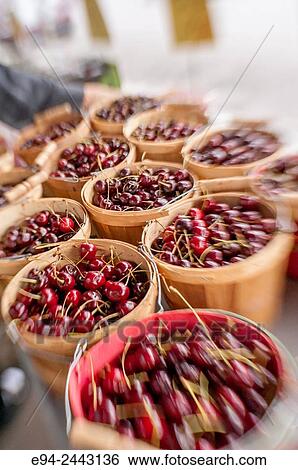 Fresh cherries in baskets sold at an outdoor market on Penn Avenue in Pittsburgh, narrow focus. View Large Photo Image Stock Photograph - Fresh cherries in baskets sold at an outdoor market on Penn Avenue in Pittsburgh, narrow focus.. Fotosearch