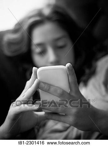 Stock Photograph - girl with technology. Fotosearch