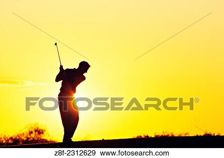 Golfer at sunset in Scottsdale, Arizona. View Large Photo Image Stock Photo - Golfer at sunset in Scottsdale, Arizona.. Fotosearch