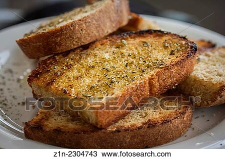 Grilled bread with olive oil and origano in a restaurant at Poulithra village. Arcadia, Peloponnese, Greece. View Large Photo Image Stock Image - Grilled bread with olive oil and origano in a restaurant at Poulithra village. Arcadia, Peloponnese, Greece.. Fotosearch