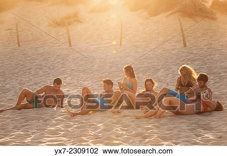 Group of friends at the beach. Punta Paloma, Tarifa, Costa de la Luz, Cadiz, Andalusia, Spain. View Large Photo Image Stock Image - Group of friends at the beach. Punta Paloma, Tarifa, Costa de la Luz, Cadiz, Andalusia, Spain.. Fotosearch