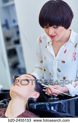 Hairdresser applying a hair treatment to a woman. Hairdressing salon and Beauty Clinic. View Large Photo Image Stock Image - Hairdresser applying a hair treatment to a woman. Hairdressing salon and Beauty Clinic.. Fotosearch