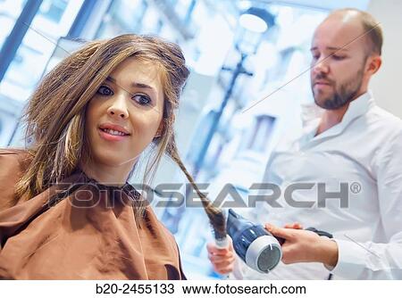 Hairdresser combing the hair of a woman. Hairdressing salon and Beauty Clinic. View Large Photo Image Stock Image - Hairdresser combing the hair of a woman. Hairdressing salon and Beauty Clinic.. Fotosearch