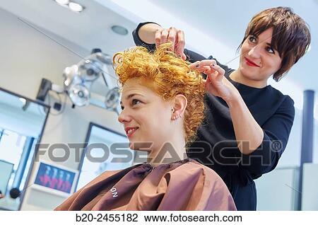 Hairdresser combing the hair of a woman. Hairdressing salon and Beauty Clinic. View Large Photo Image Stock Image - Hairdresser combing the hair of a woman. Hairdressing salon and Beauty Clinic.. Fotosearch