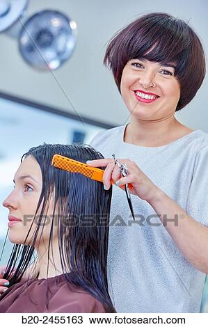 Hairdresser cutting the hair of a woman. Hairdressing salon and Beauty Clinic. View Large Photo Image Stock Image - Hairdresser cutting the hair of a woman. Hairdressing salon and Beauty Clinic.. Fotosearch