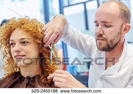 Hairdresser cutting the hair of a woman. Hairdressing salon and Beauty Clinic. View Large Photo Image Stock Photo - Hairdresser cutting the hair of a woman. Hairdressing salon and Beauty Clinic.. Fotosearch