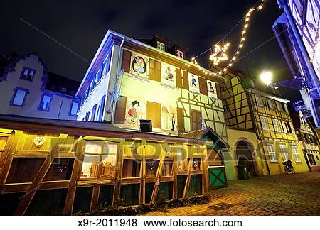 Stock Photo - Hansi drawings Christmas decoration by night at the Little Venice. Colmar. Wine route. Haut-Rhin. Alsace. France.. Fotosearch