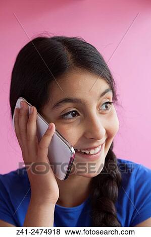 Happy teenage girl with her mobile phone. View Large Photo Image Stock Photo - Happy teenage girl with her mobile phone.. Fotosearch