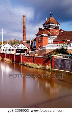 Stock Image - Harveys Brewery and River Ouse, Lewes, Sussex, England.. Fotosearch