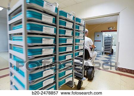 Internal transportation of food in motorcars, Kitchen, Hospital Donostia, San Sebastian, Gipuzkoa, Basque Country, Spain View Large Photo Image Stock Photo - Internal transportation of food in motorcars, Kitchen, Hospital Donostia, San Sebastian, Gipuzkoa, Basque Country, Spain. Fotosearch