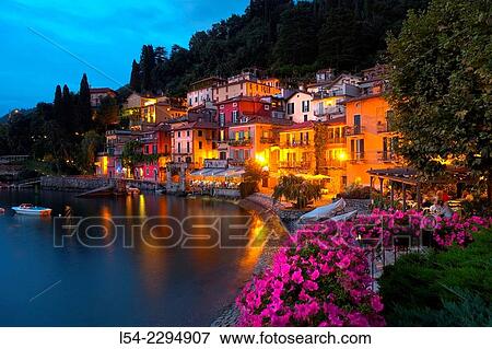 Italy, Lombardy, Lake Como, Varenna, View of illuminated waterfront at lake View Large Photo Image Stock Photo - Italy, Lombardy, Lake Como, Varenna, View of illuminated waterfront at lake. Fotosearch