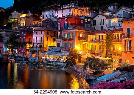 Italy, Lombardy, Lake Como, Varenna, View of illuminated waterfront at lake View Large Photo Image Stock Photo - Italy, Lombardy, Lake Como, Varenna, View of illuminated waterfront at lake. Fotosearch