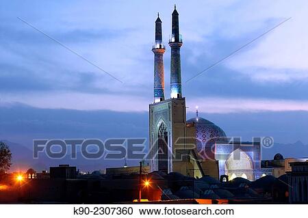 Stock Image - Jameh mosque at night with overview of Yazd, Iran, Asia.. Fotosearch