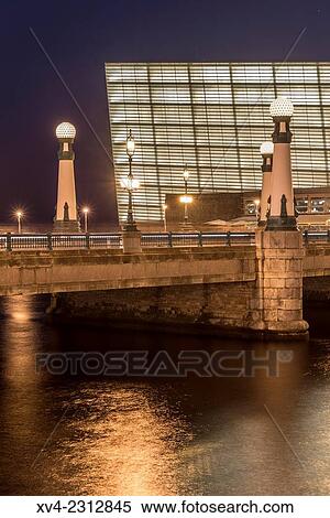 Stock Photography - Kursaal bridge. Old town of San Sebastián by night. Donostia, Basque Country, Spain.. Fotosearch